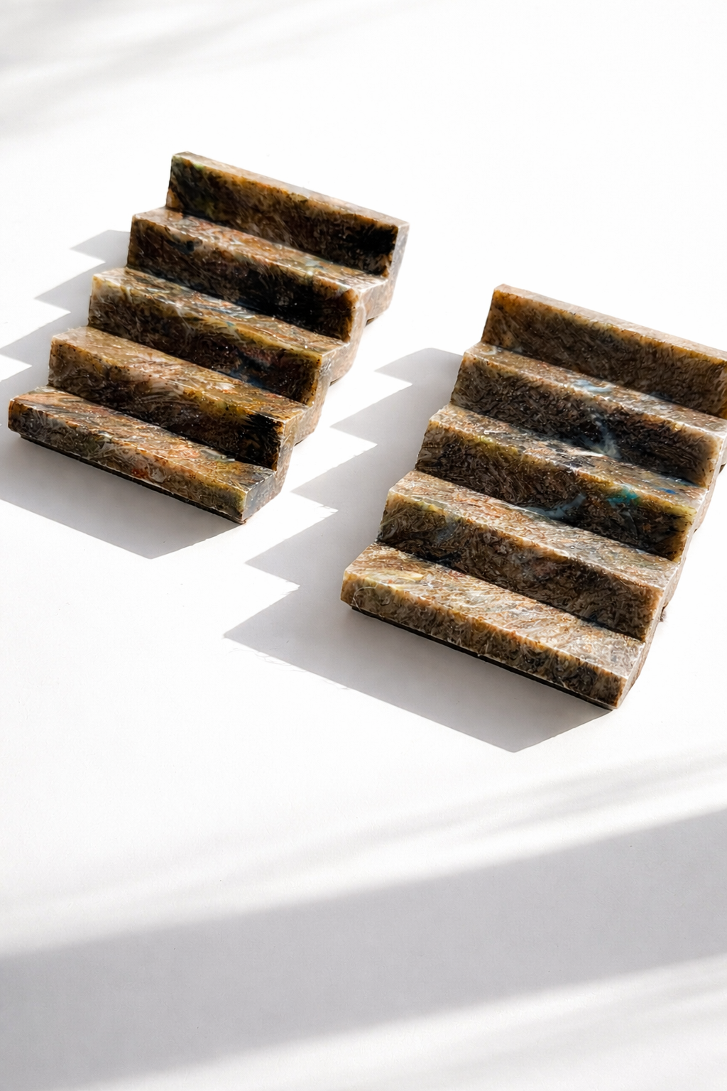 Set of zigzag recycled plastic soap dishes with rectangular slots for drainage