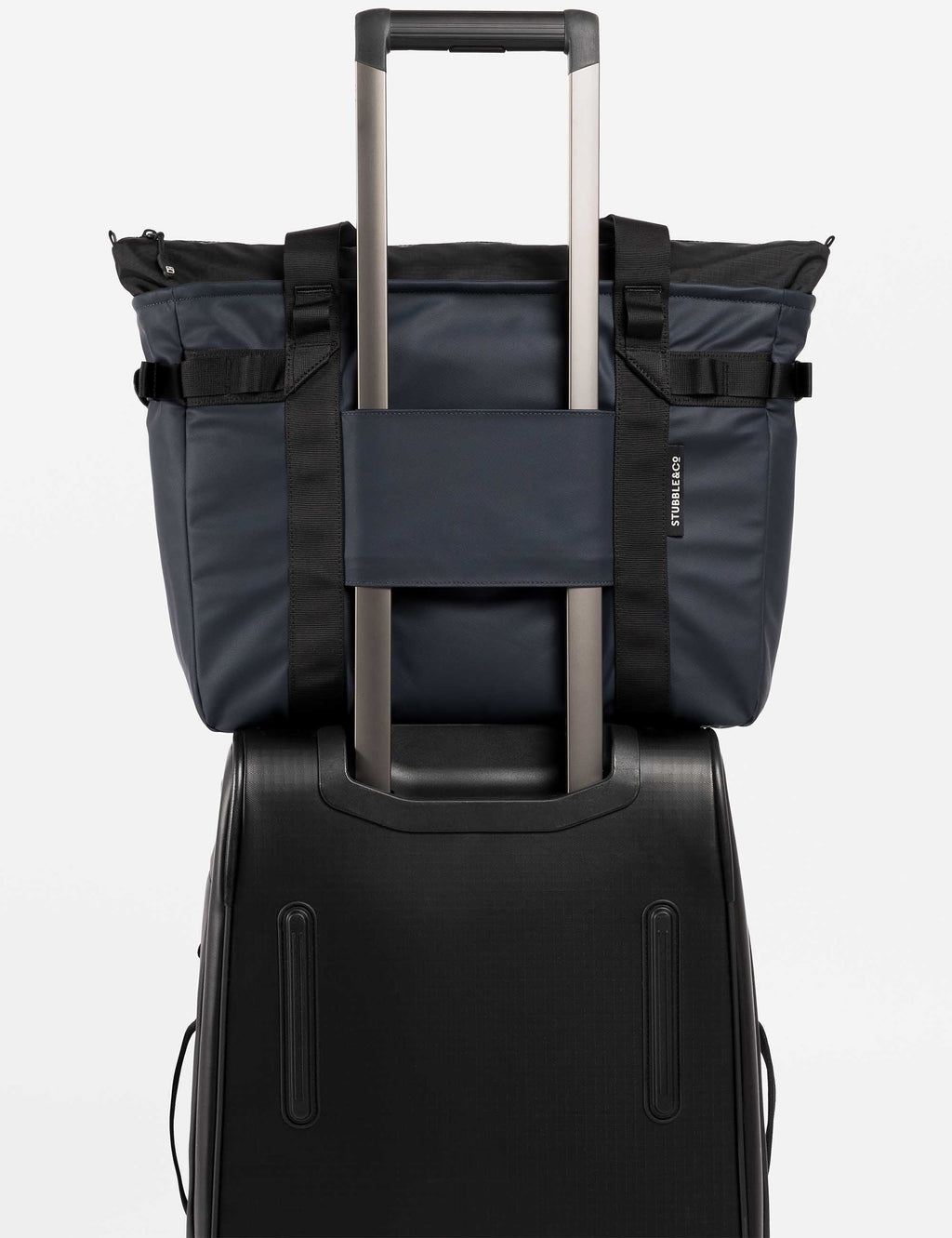 Midnight blue laptop tote bag with exterior straps and side panels