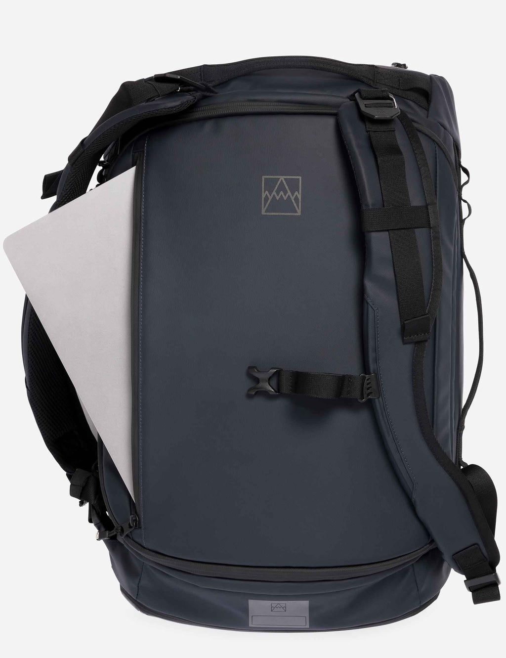 Midnight blue duffel backpack back panel with logo patch and adjustable shoulder straps