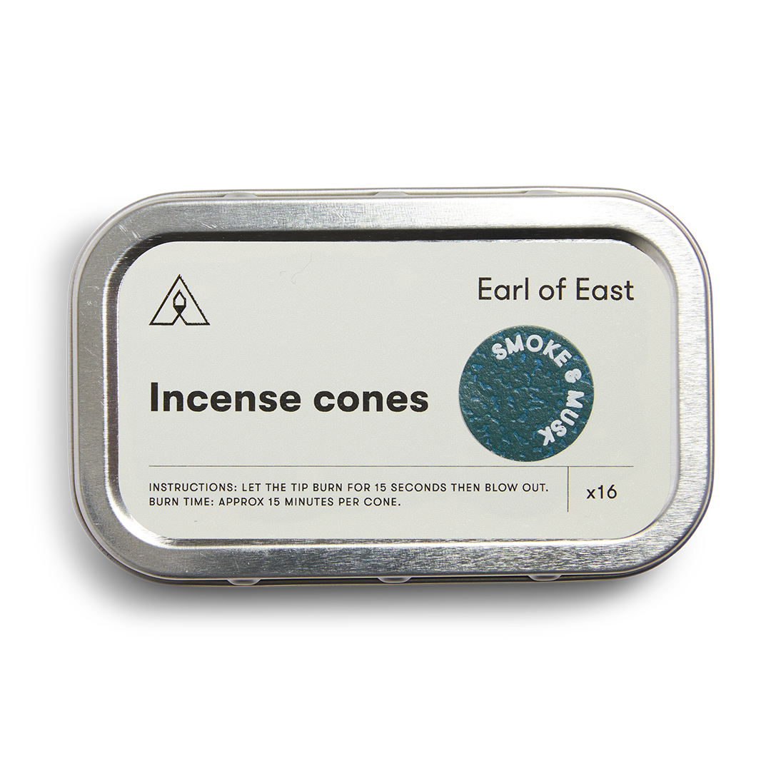Metal tin packaging for Earl of East incense cones on a white background