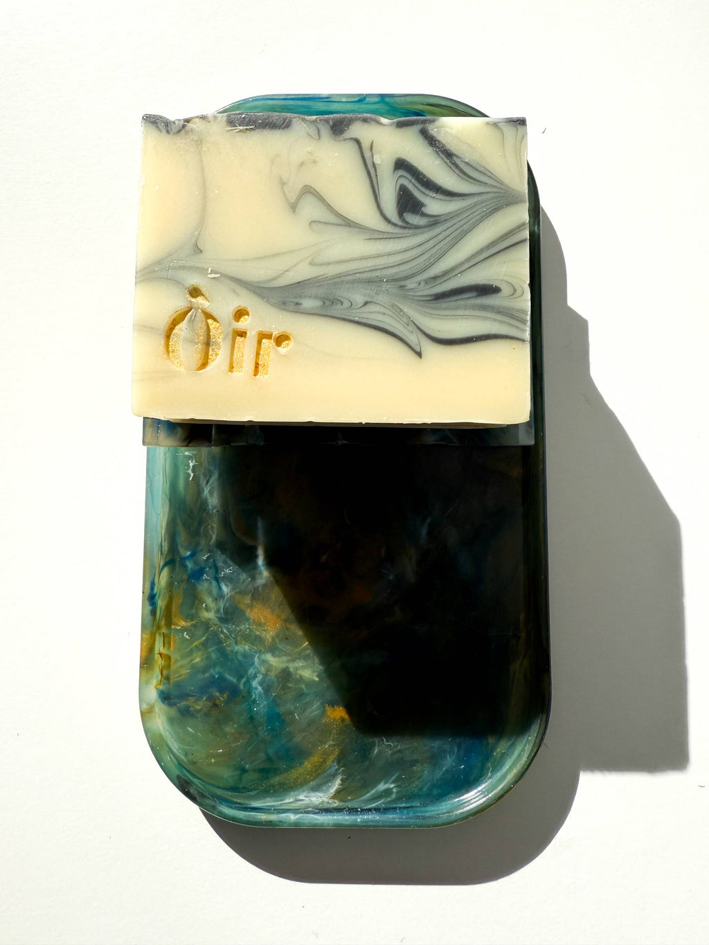 Marbled recycled plastic tray, teal-blue marbling with yellow and white swirls