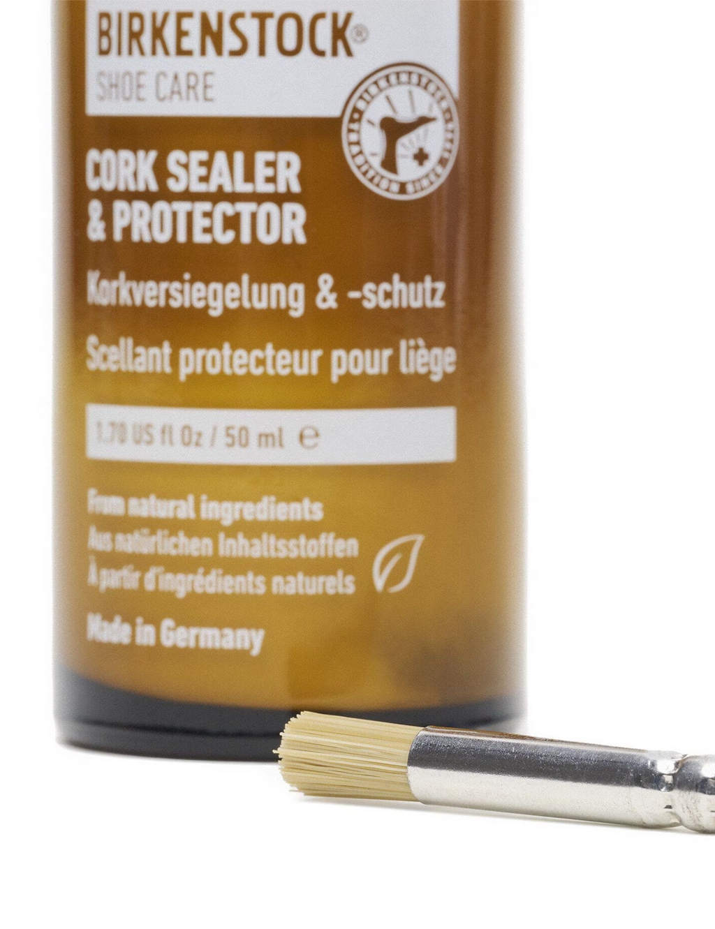 Amber cork sealer bottle with included brush, front label visible