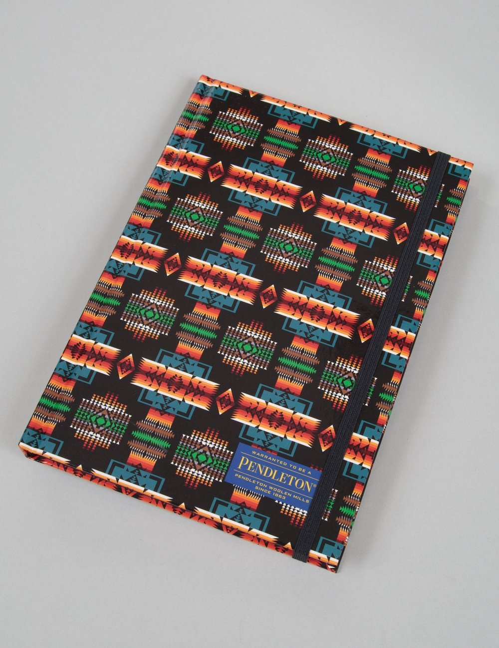 Printed lined notebook with black patterned cover and Pendleton logo