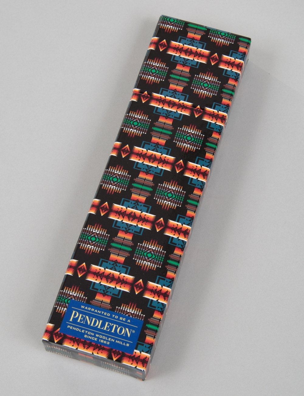 Printed pencil roll case, colorful geometric pattern on black, brand label at bottom