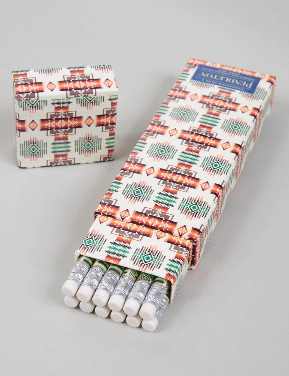 Printed 12-pencil set with white, green, and orange pattern wrap; pencils protrude