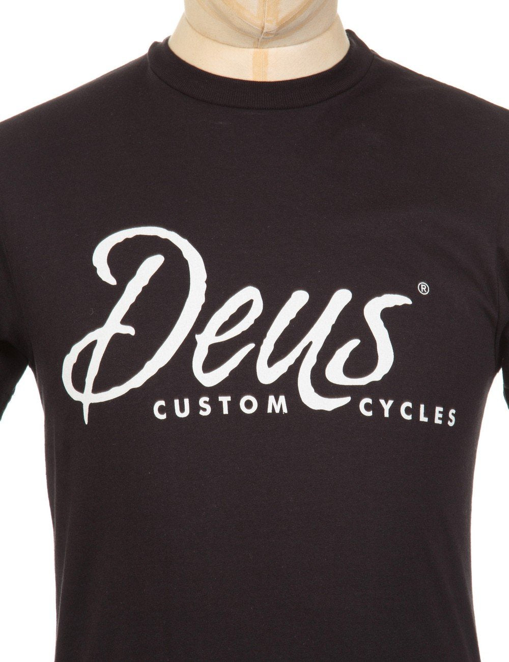 Black short-sleeve t-shirt with large white Deus Custom Cycles chest graphic