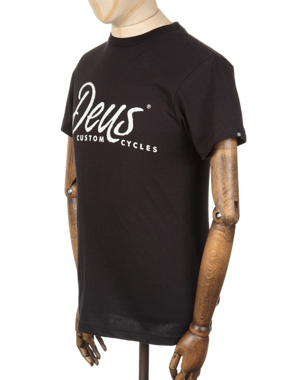 Black short-sleeve t-shirt with small left-chest white Deus Custom Cycles logo