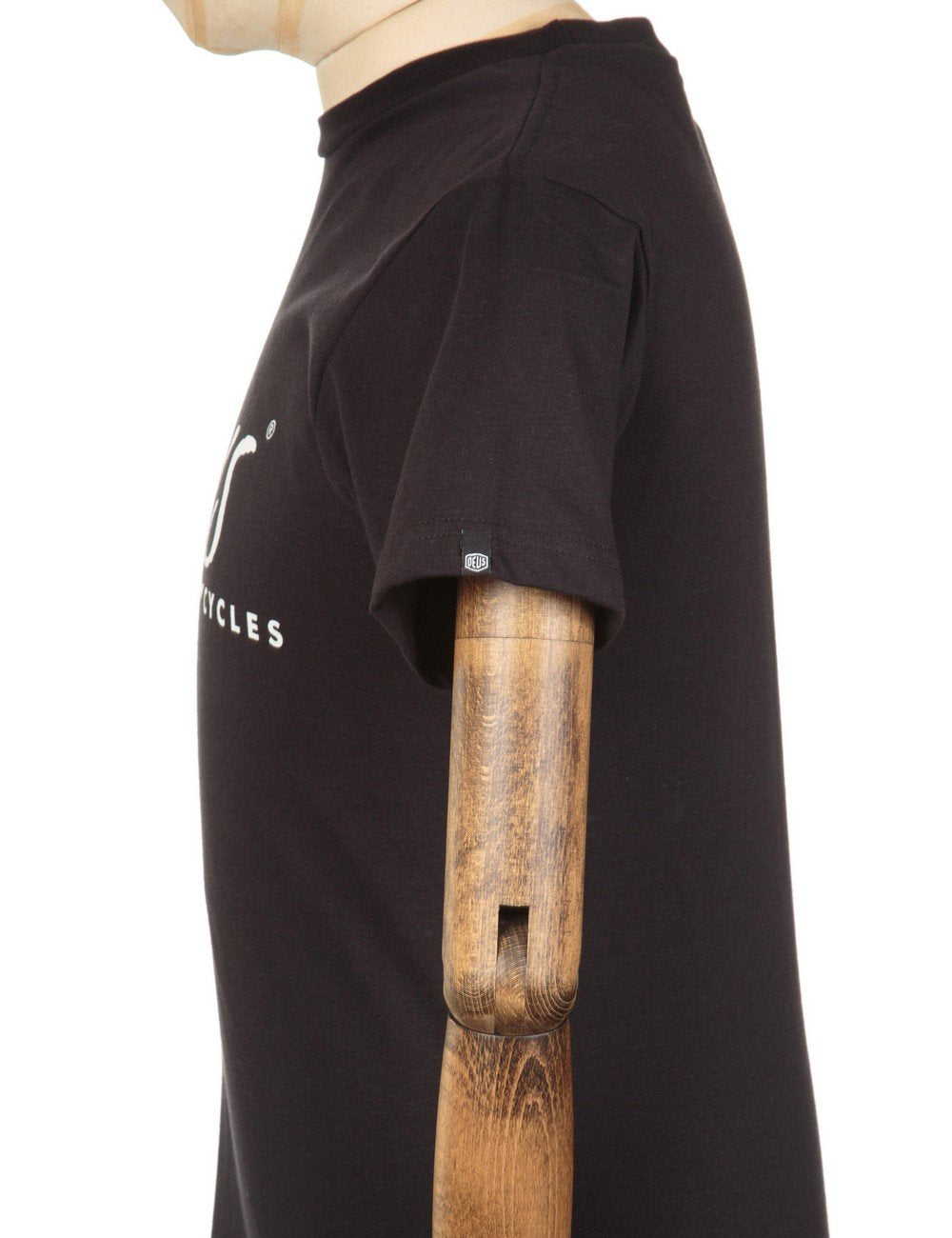 Black short-sleeve t-shirt with partial left-chest white logo, side view