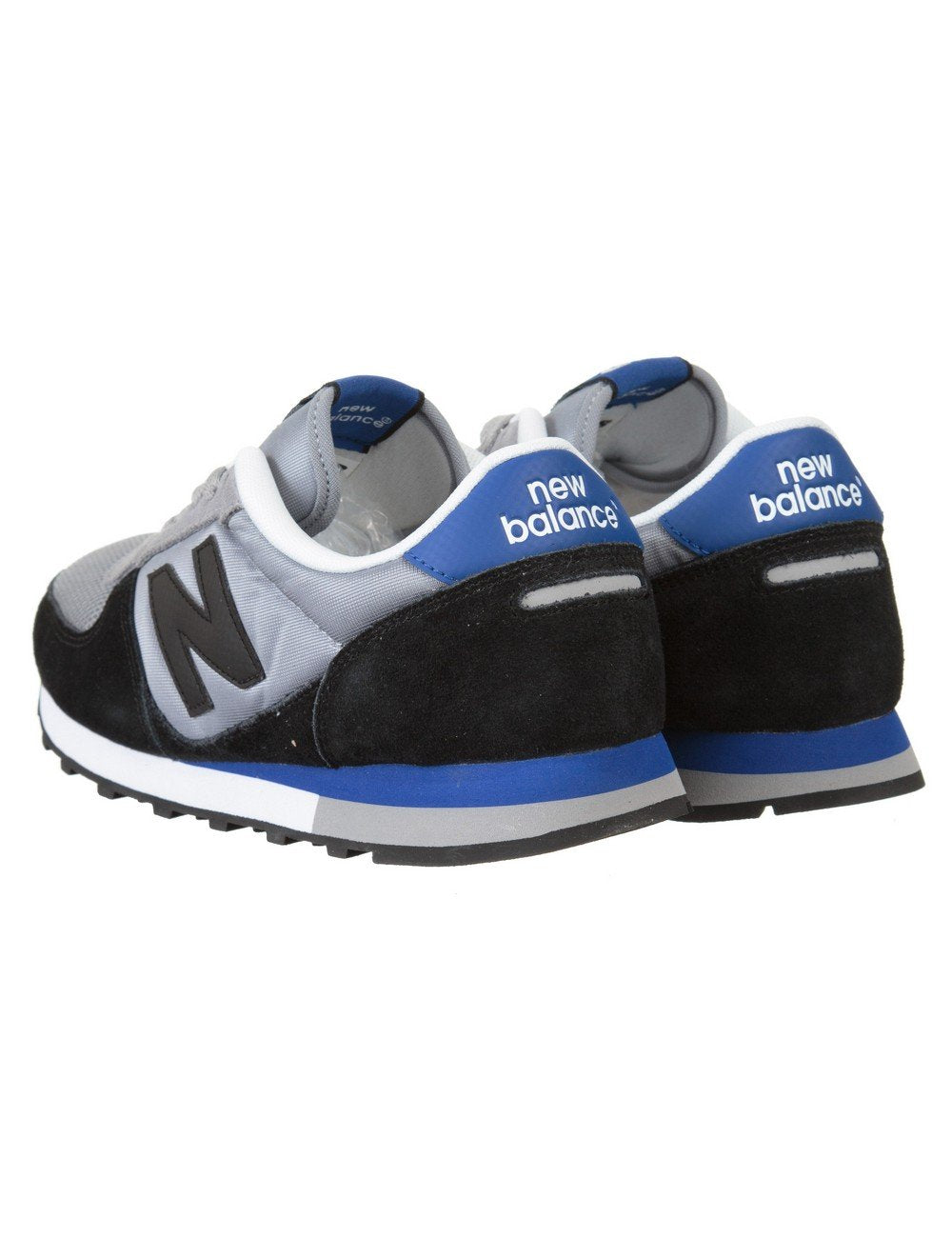 Trainers with grey uppers, black heel backs, blue New Balance tab and N logo