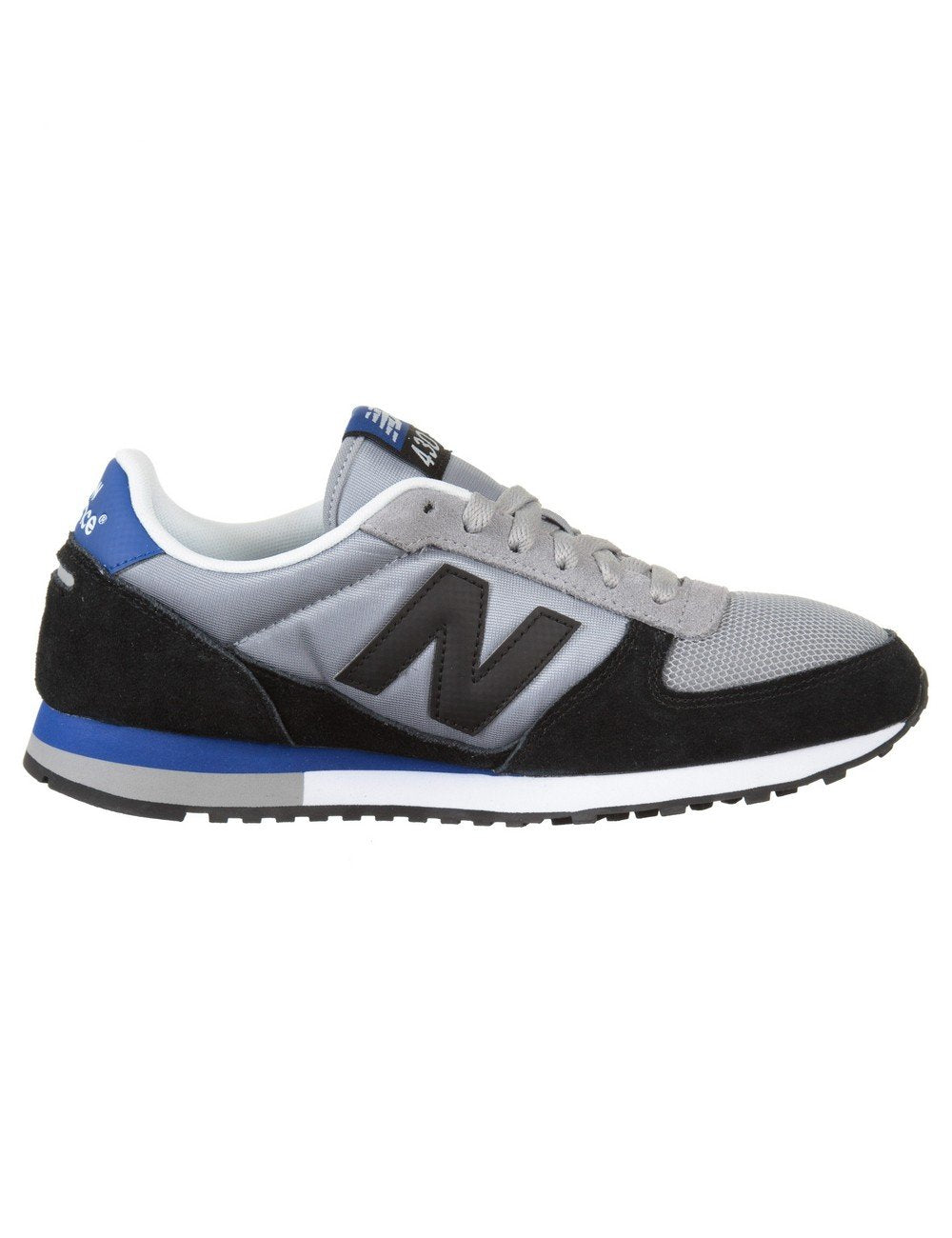 Grey and black trainers with blue accents, lace-up front and N logo side profile