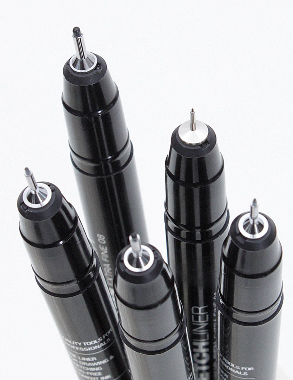 Five black fineliner marker pens with pointed tips and ribbed barrels