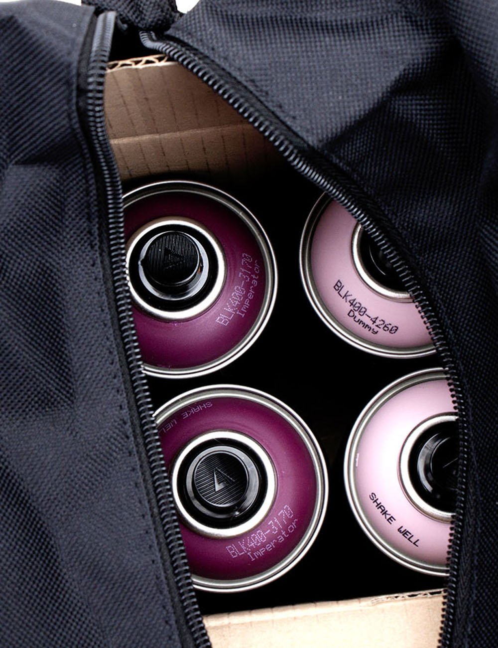 Black nylon bag interior with zipper opening and cup-holder style pockets