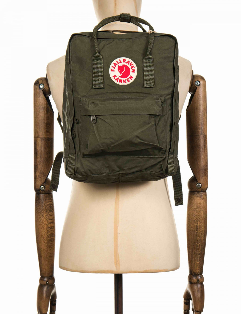 Dark green Kanken Classic backpack with Fjallraven logo patch and two front pockets