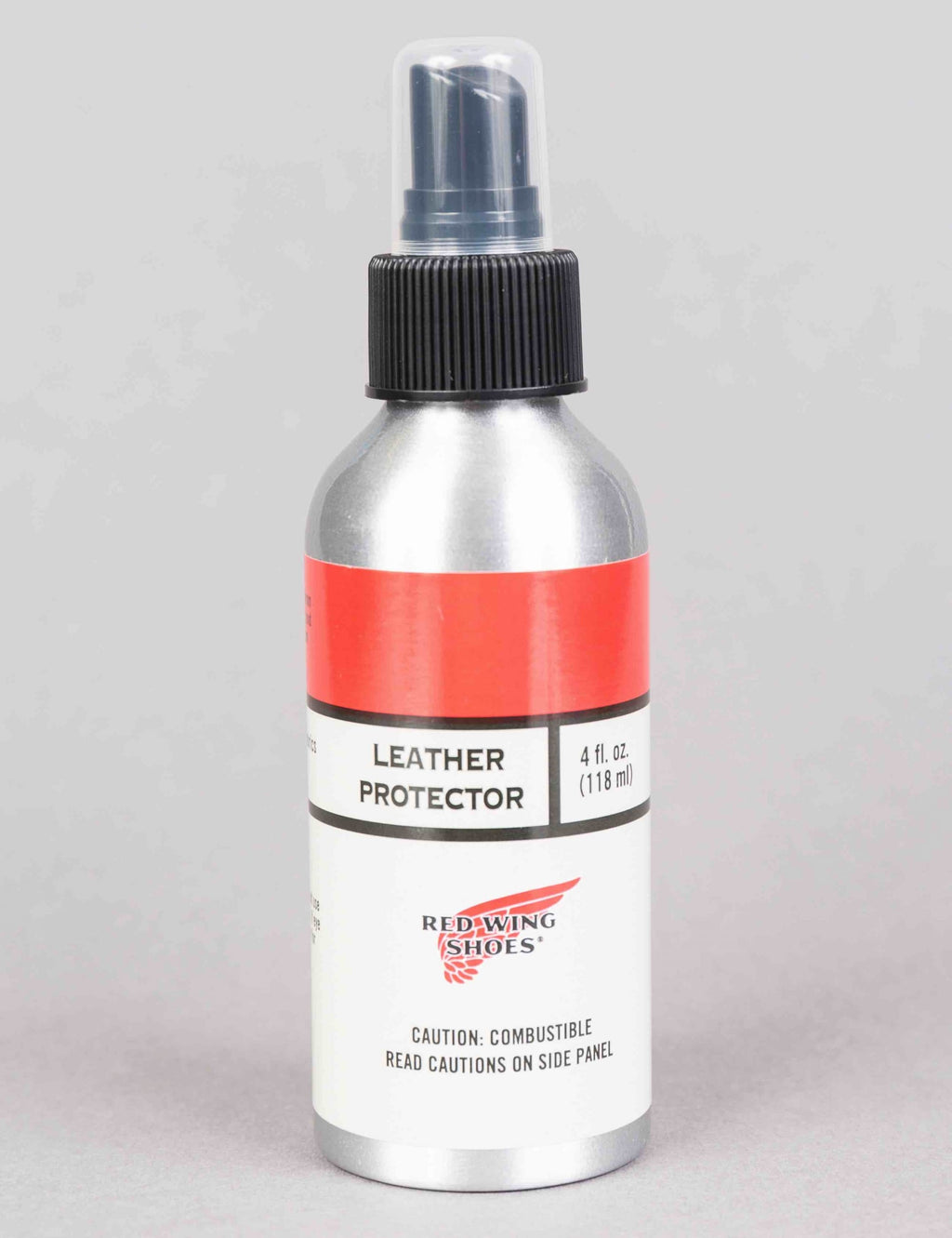 Leather protector spray bottle with black ribbed pump, silver body, red label band.