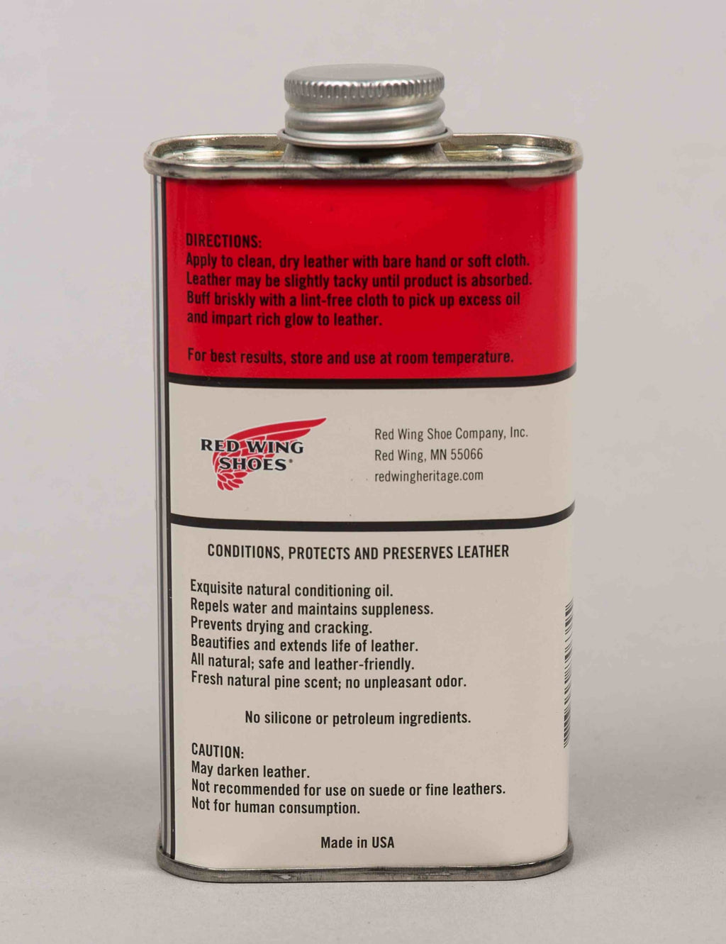 Boot oil bottle back label with red top panel and silver screw cap