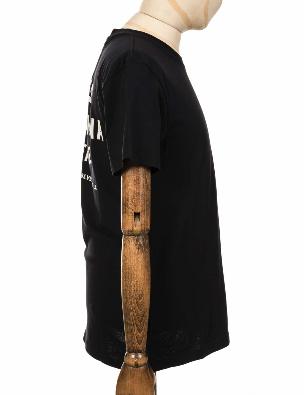 Black crewneck T-shirt side view with partial back print visible