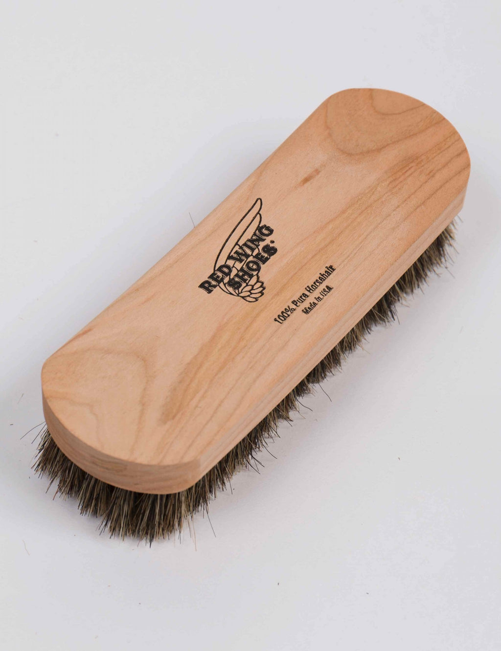 Horse hair brush with curved wooden handle, RED WING SHOES printed