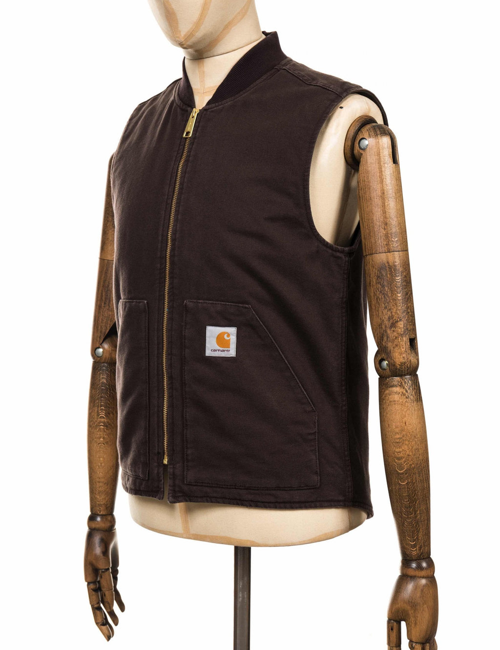 Dark brown sleeveless vest with front zip, chest pocket, and Carhartt logo patch