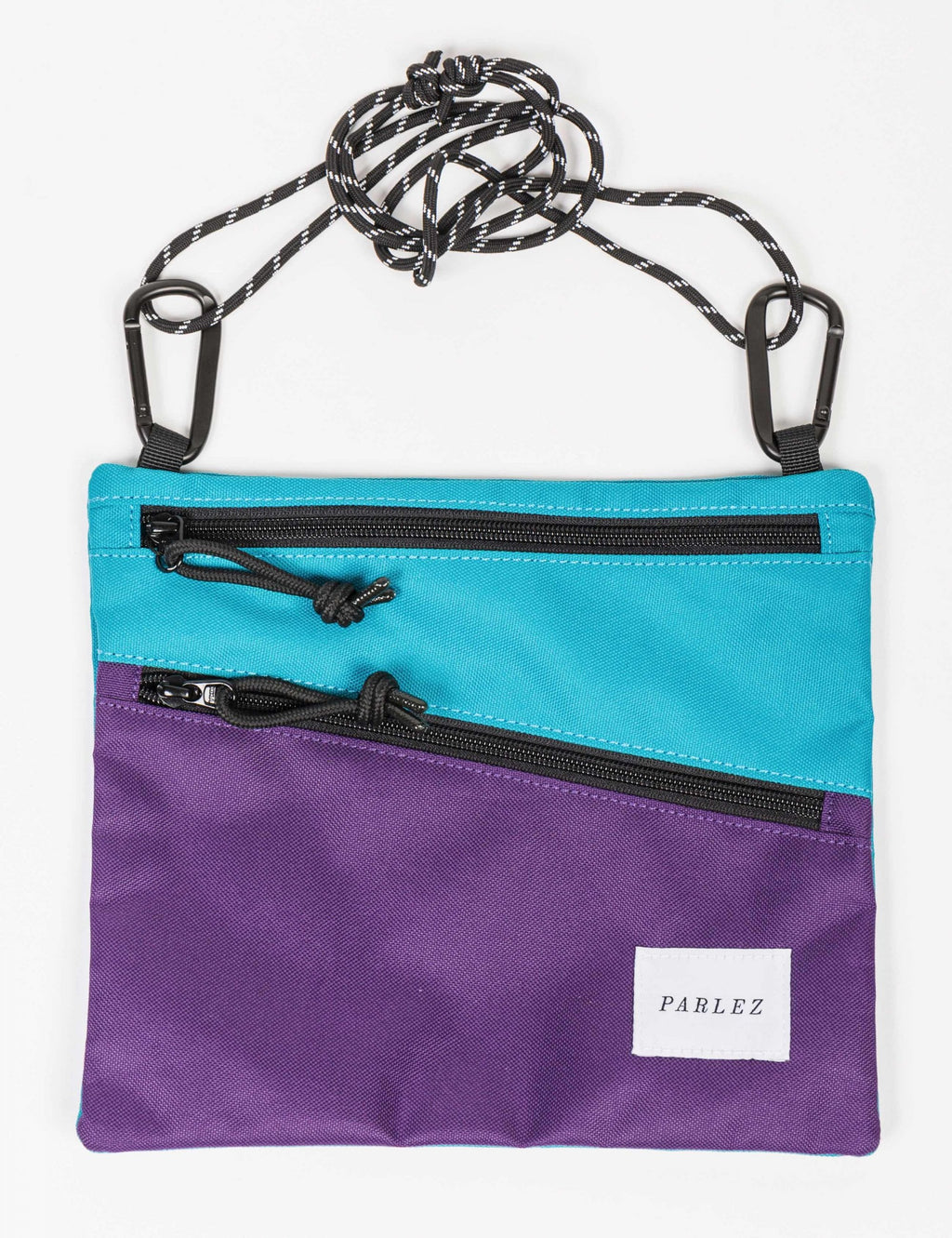 Multi-color hip bag with turquoise and purple panels, zipped front and PARLEZ label