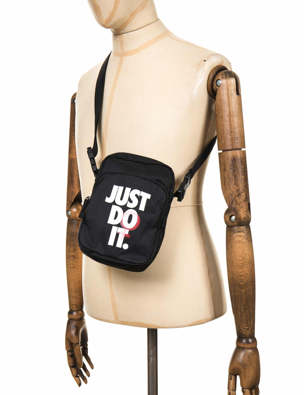 Black small crossbody bag with adjustable shoulder strap and JUST DO IT graphic