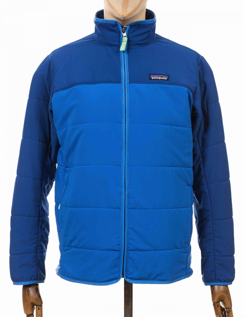 Packable blue puffer jacket with full-zip and stand collar, chest logo patch