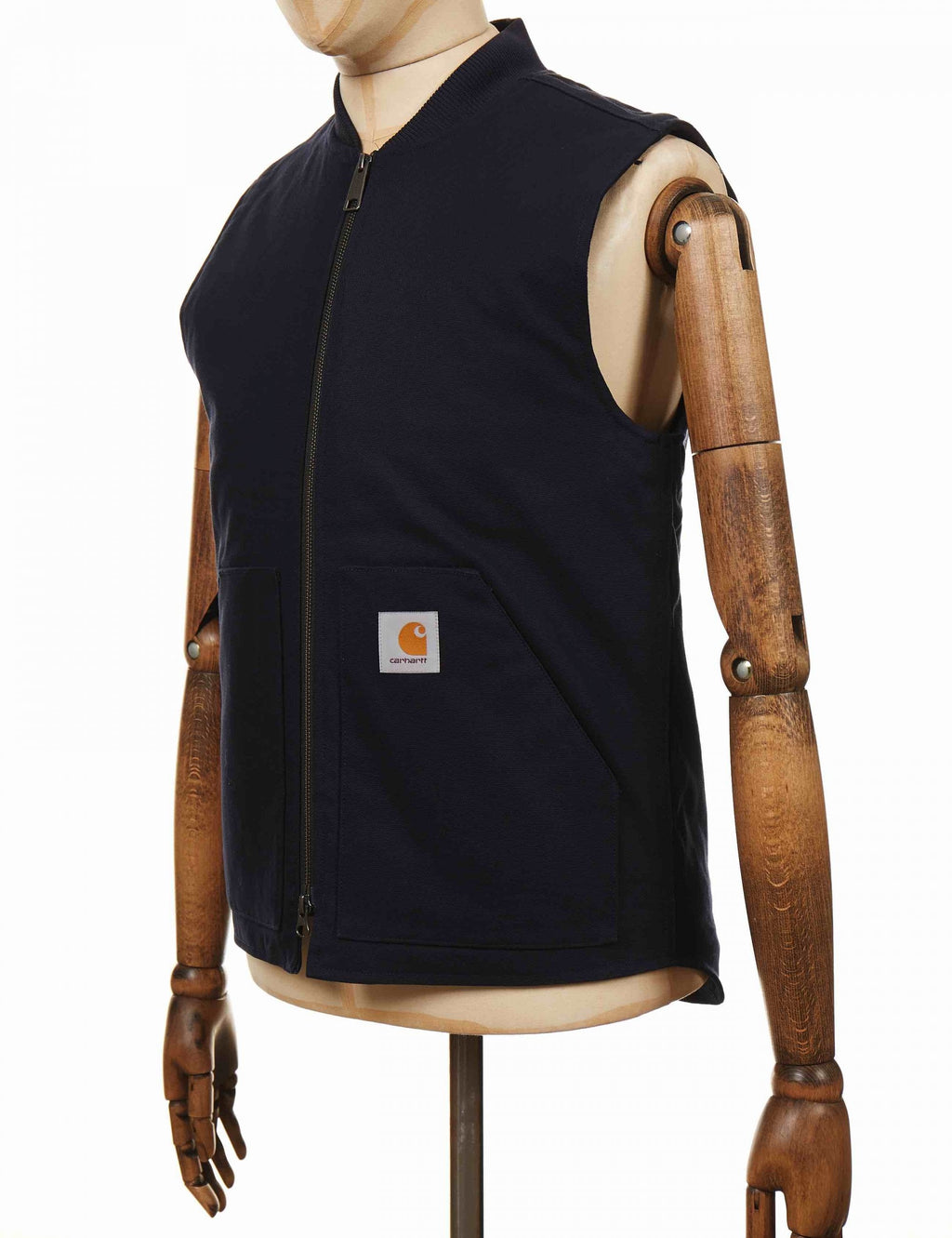 Dark navy sleeveless zip-front vest with logo patch on chest
