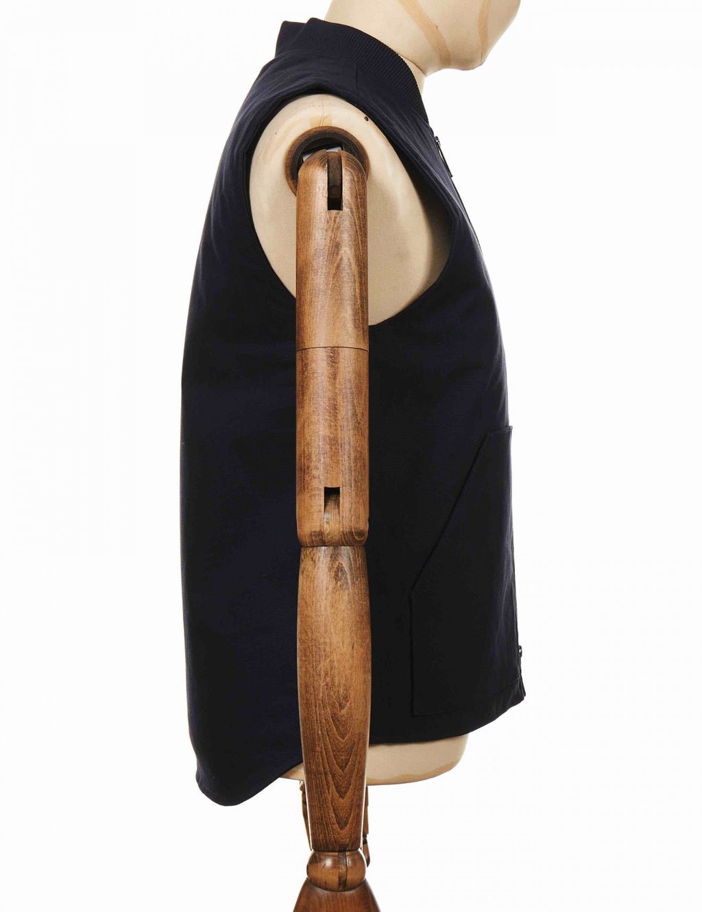 Dark navy sleeveless vest with side panel seam and curved hem
