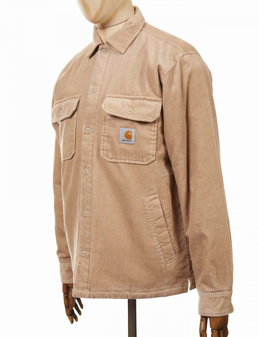 Tan shirt jacket with button front, chest patch pocket, sleeve pocket detail.