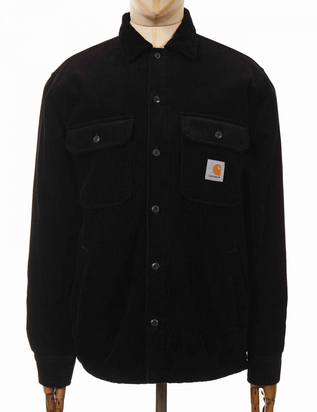 Black shirt-jacket with button front, stand collar, chest pockets, and logo patch
