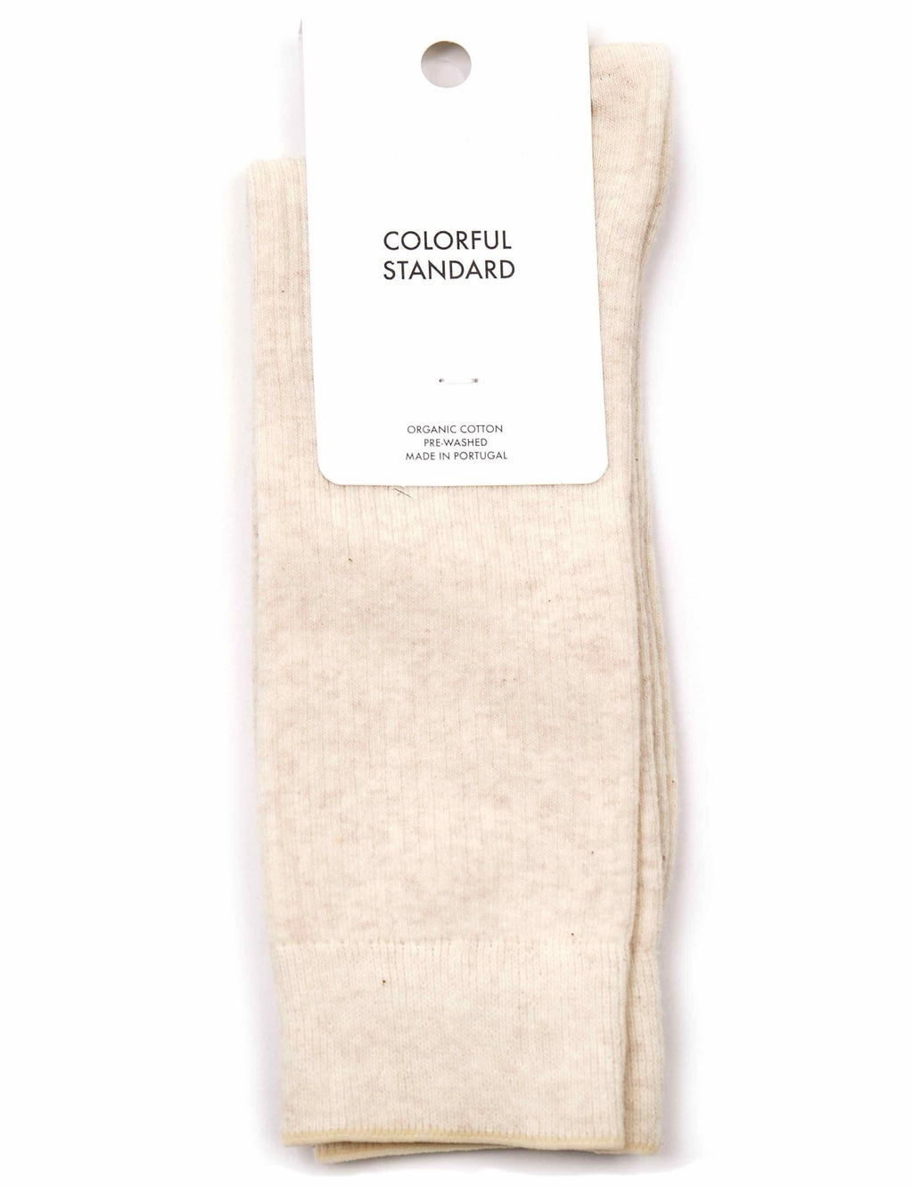Ivory organic crew sock with cuff ribbing, showing attached brand label