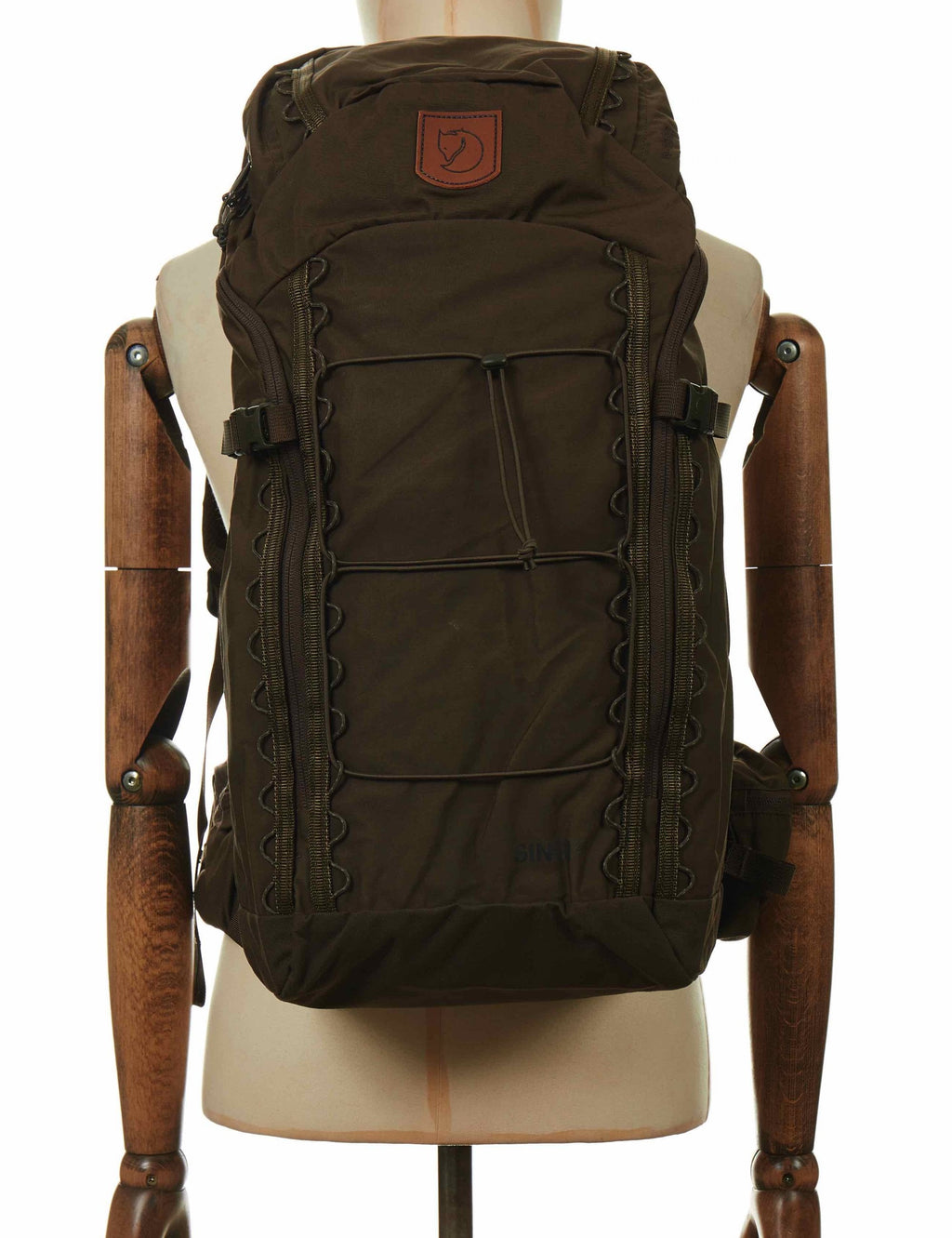 Dark olive 28L backpack with top handle, front organizer panel, and webbing straps