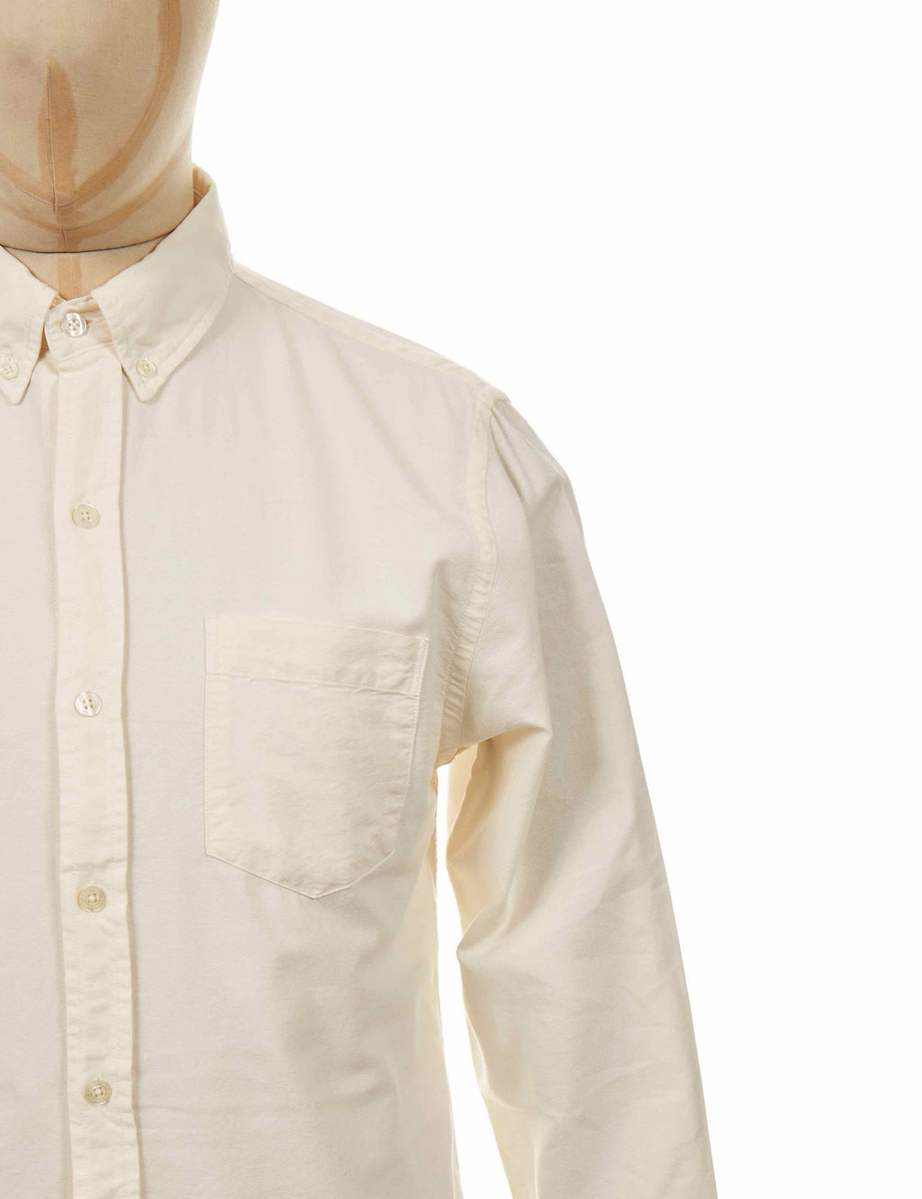 Ivory button-down shirt close-up with chest pocket and long sleeve