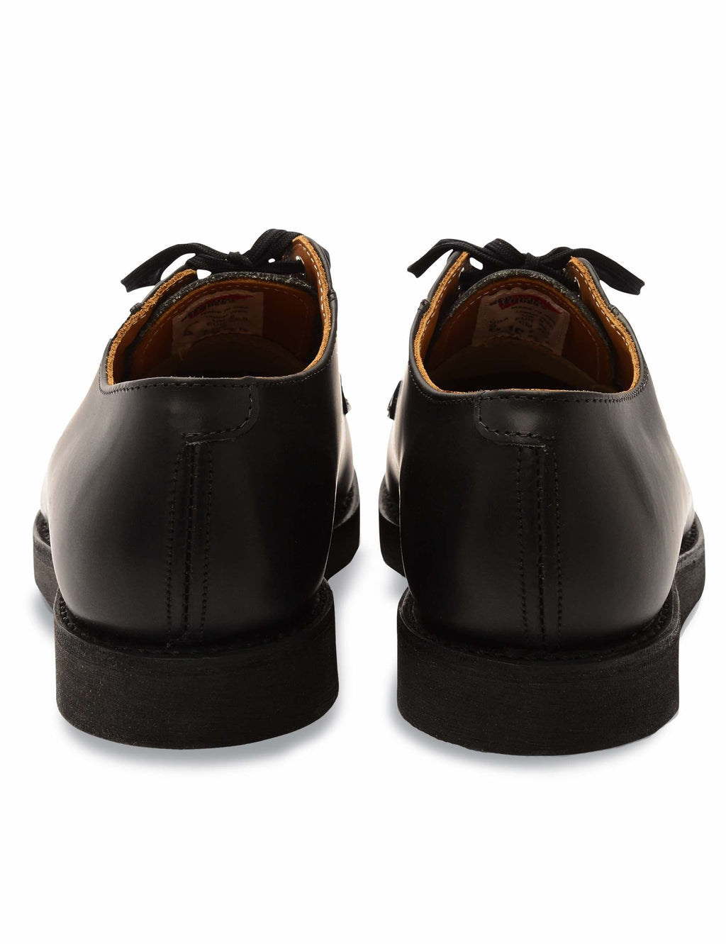 Black leather oxford work shoes, back view showing heel seam and lace-up closure.
