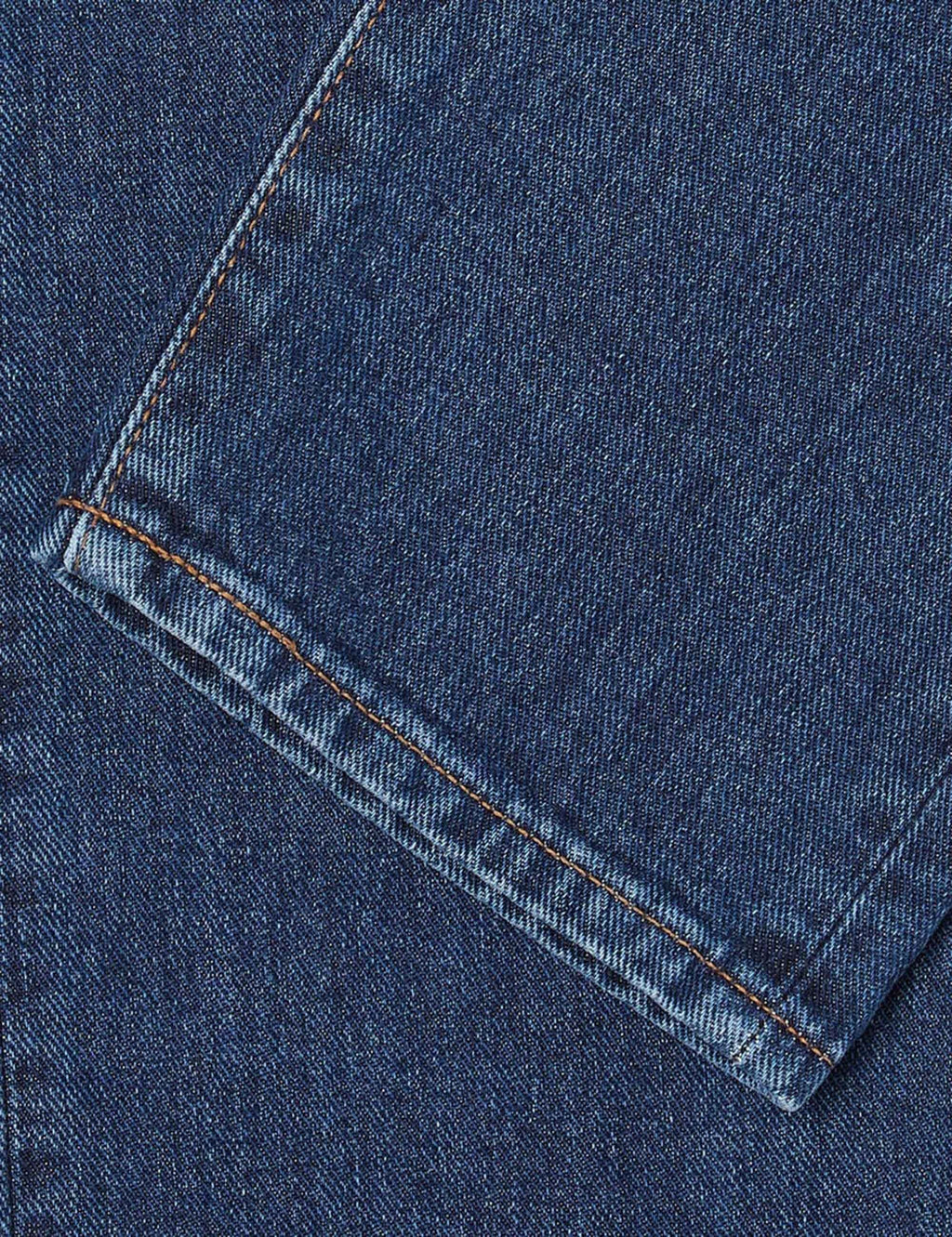 Blue denim jeans cuff with contrast orange stitch detail
