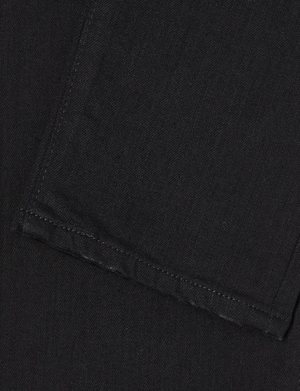Black denim fabric with visible topstitching along pocket seam