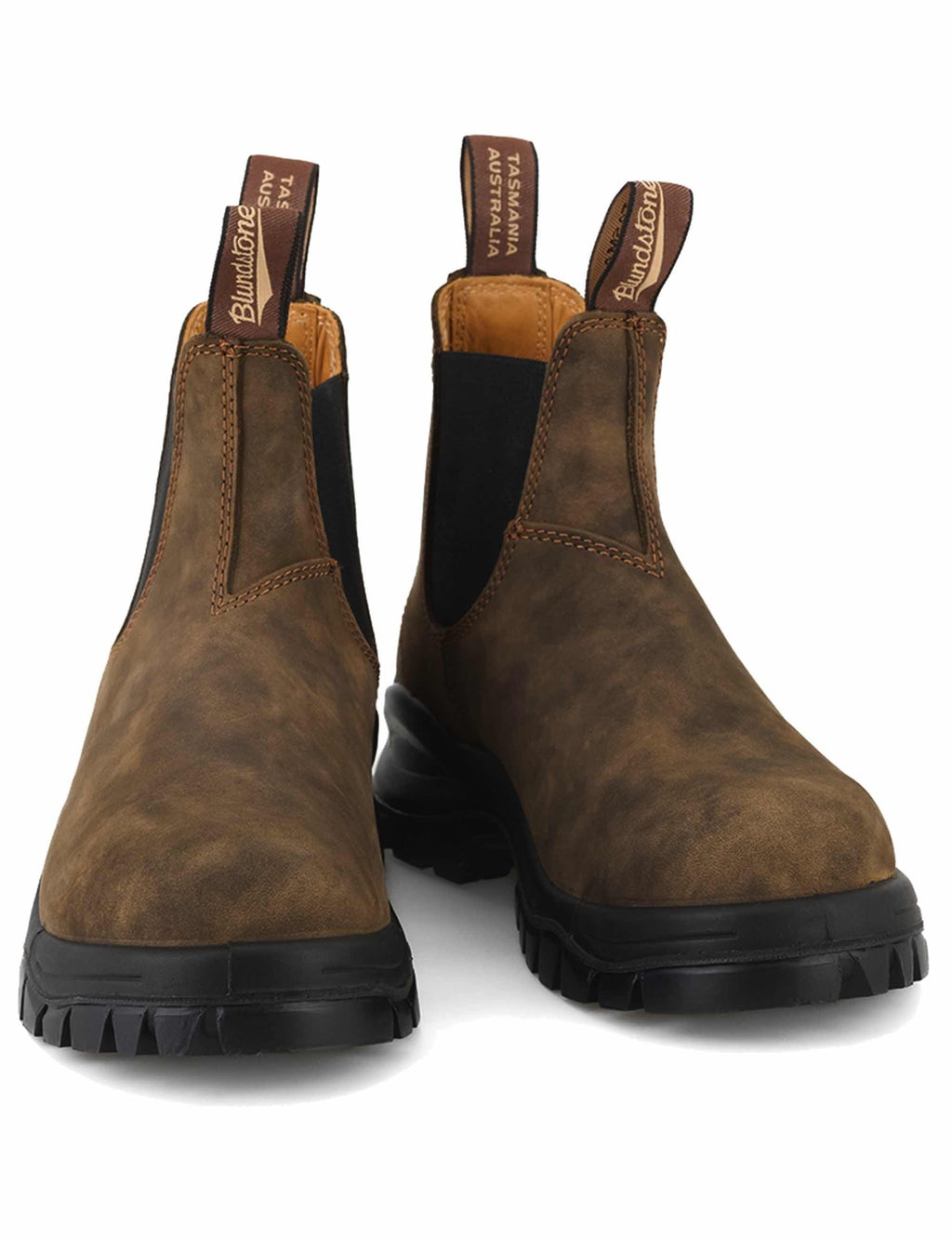 Rustic brown Chelsea boots with elastic side panels and thick black lug sole
