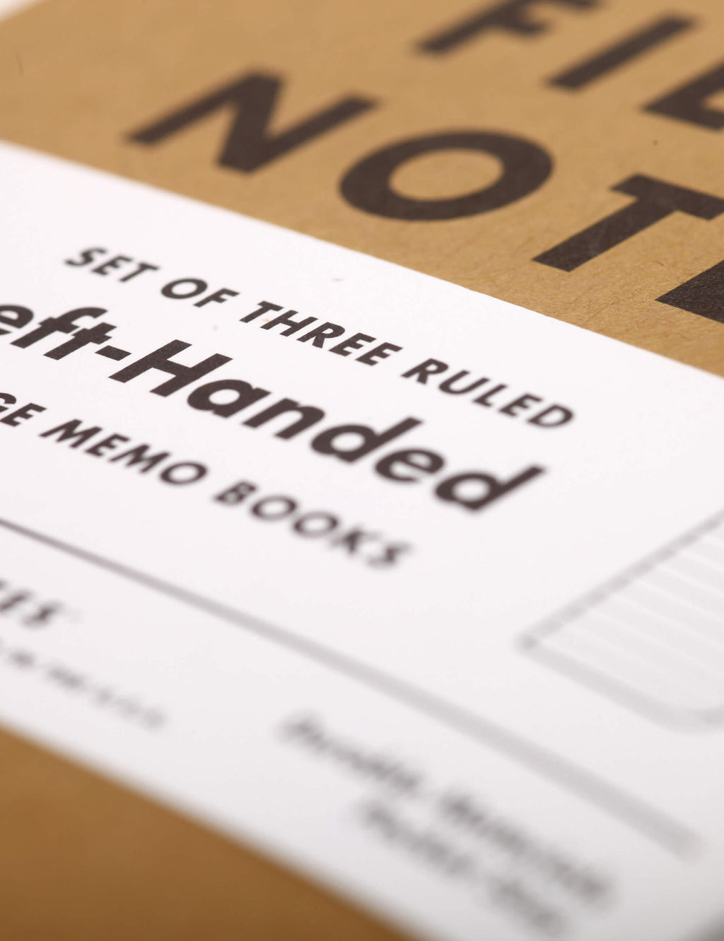 Left-handed memo books text on white and kraft packaging label.