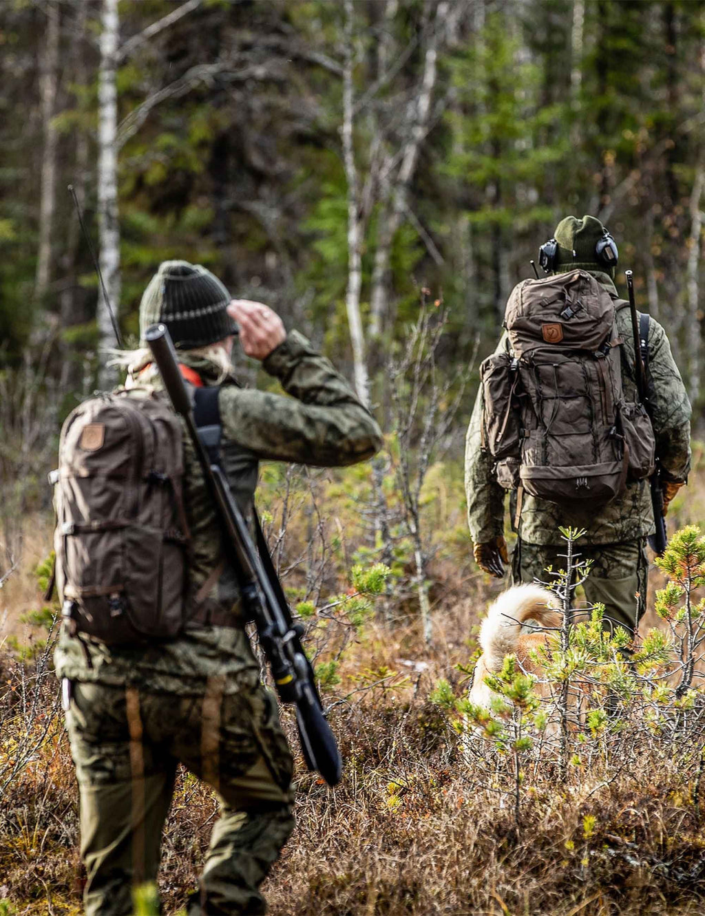 Dark olive hiking backpack on person outdoors, with backpack straps visible