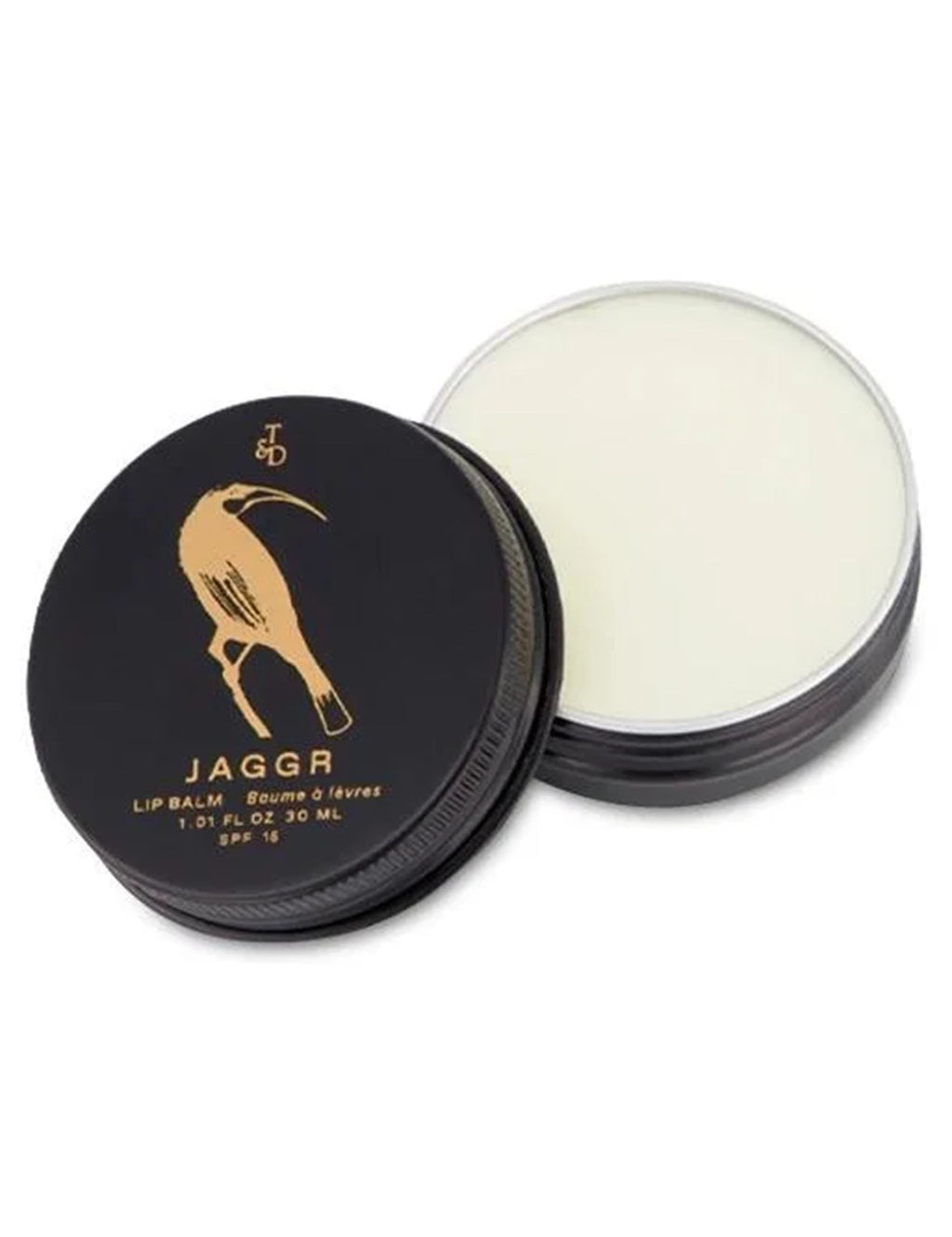 Black lip balm tin open with pale balm top visible and white base