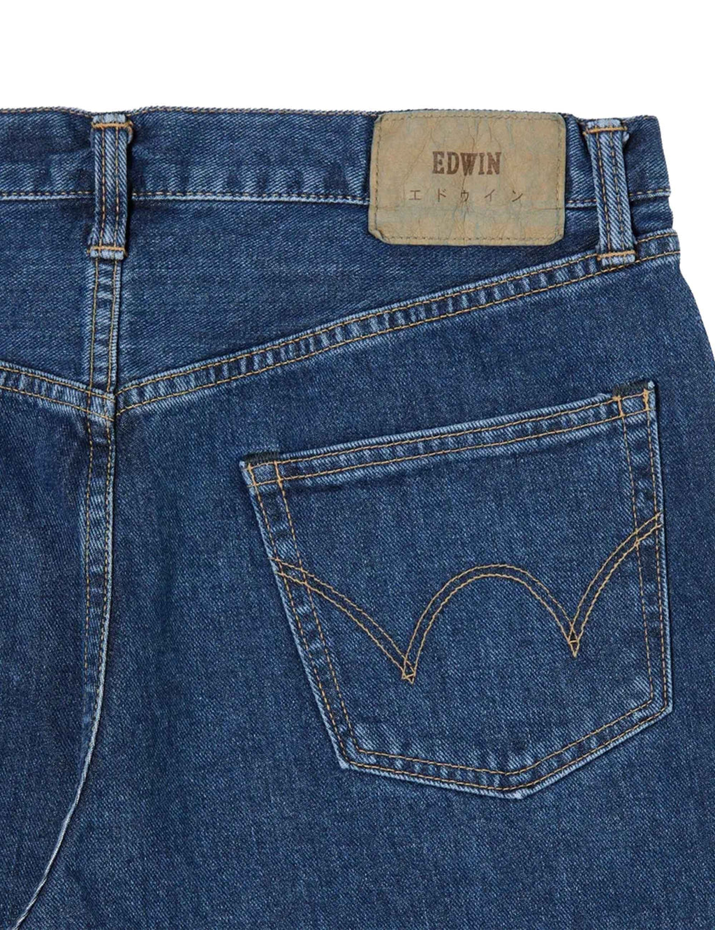 Blue denim back pocket with decorative V-stitching and EDWIN label patch above.
