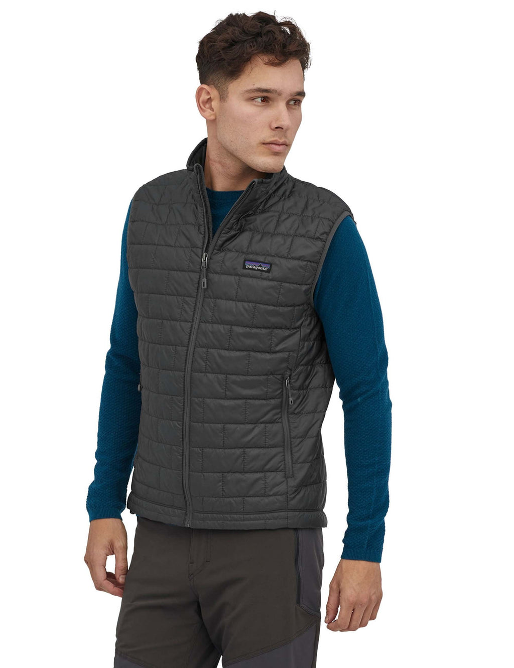 Nano Puff vest in dark gray with full-zip front and stand collar, small chest logo patch