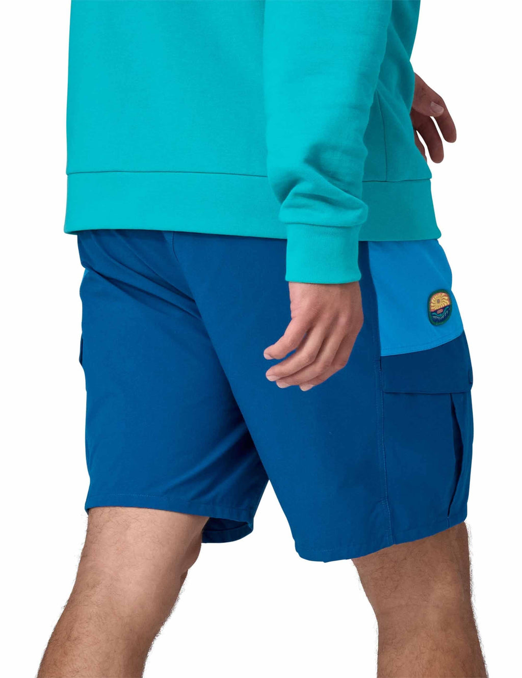 Blue cargo shorts with snap button pocket and logo patch, relaxed fit