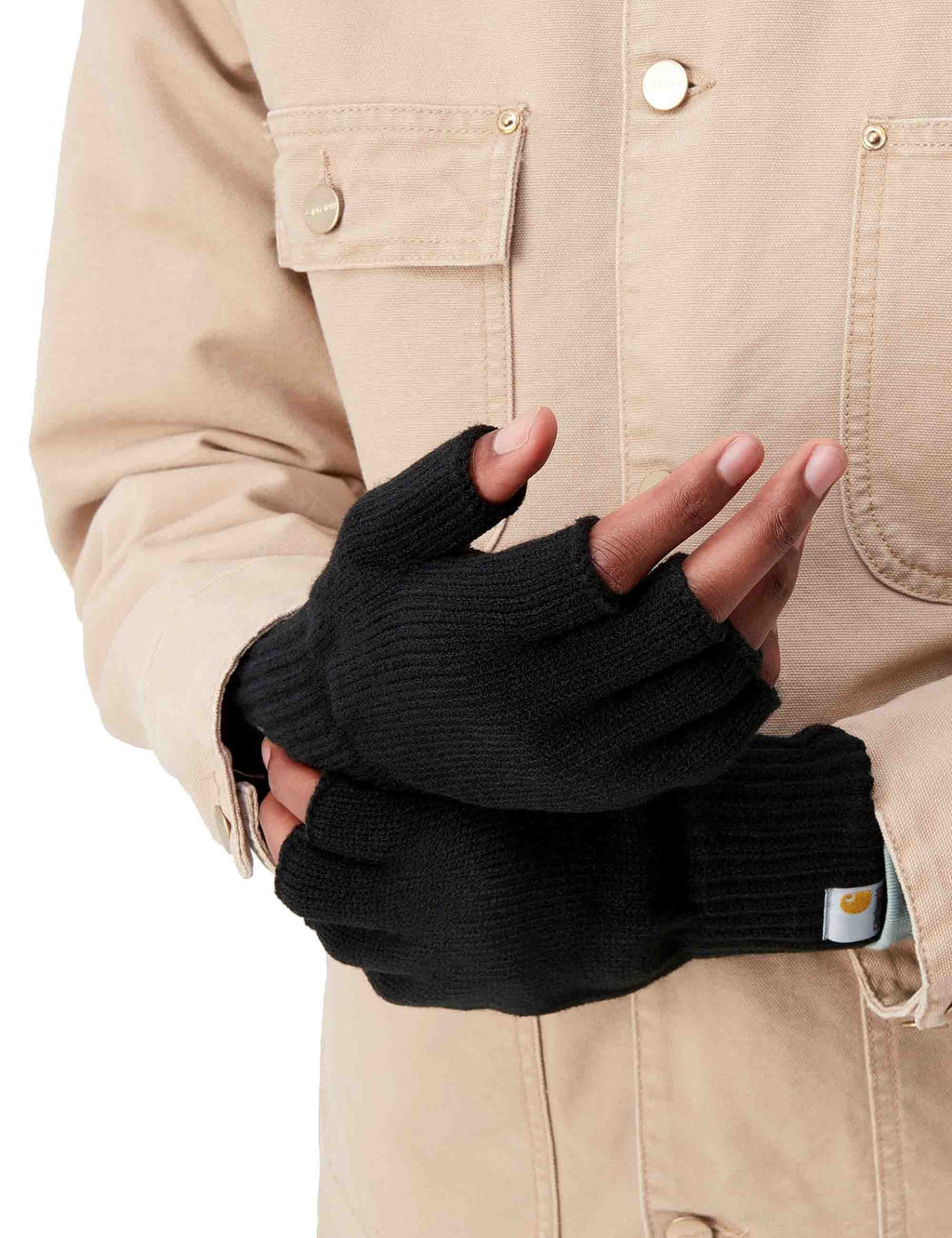 Black knit mittens, shown being worn with ribbed cuffs and small logo tag