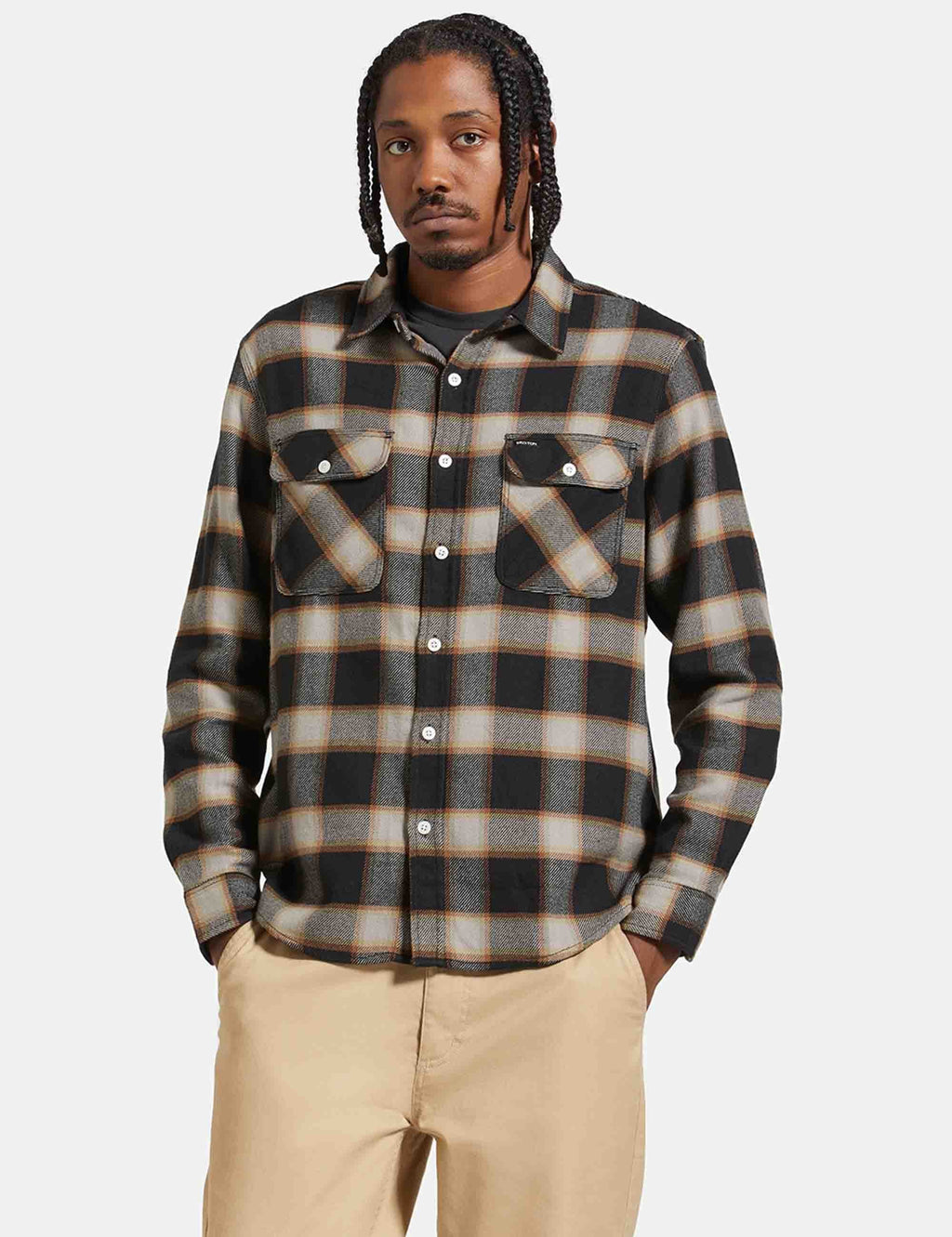 Black and cream plaid flannel shirt, long sleeves, button front, two chest pockets.
