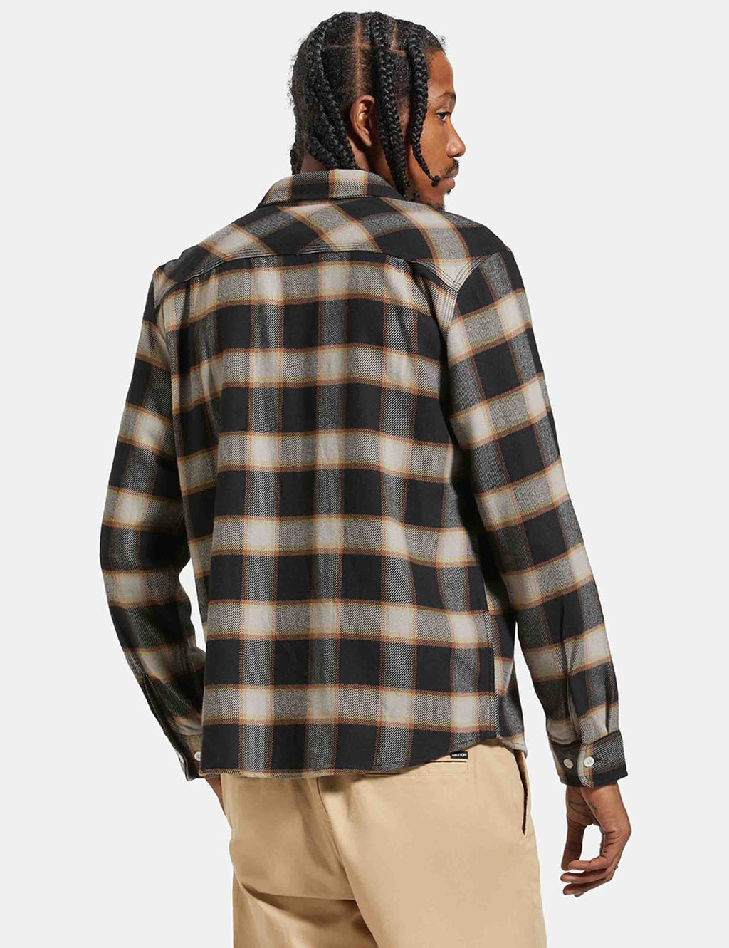 Black and cream plaid flannel shirt back view with yoke seam, long sleeves.