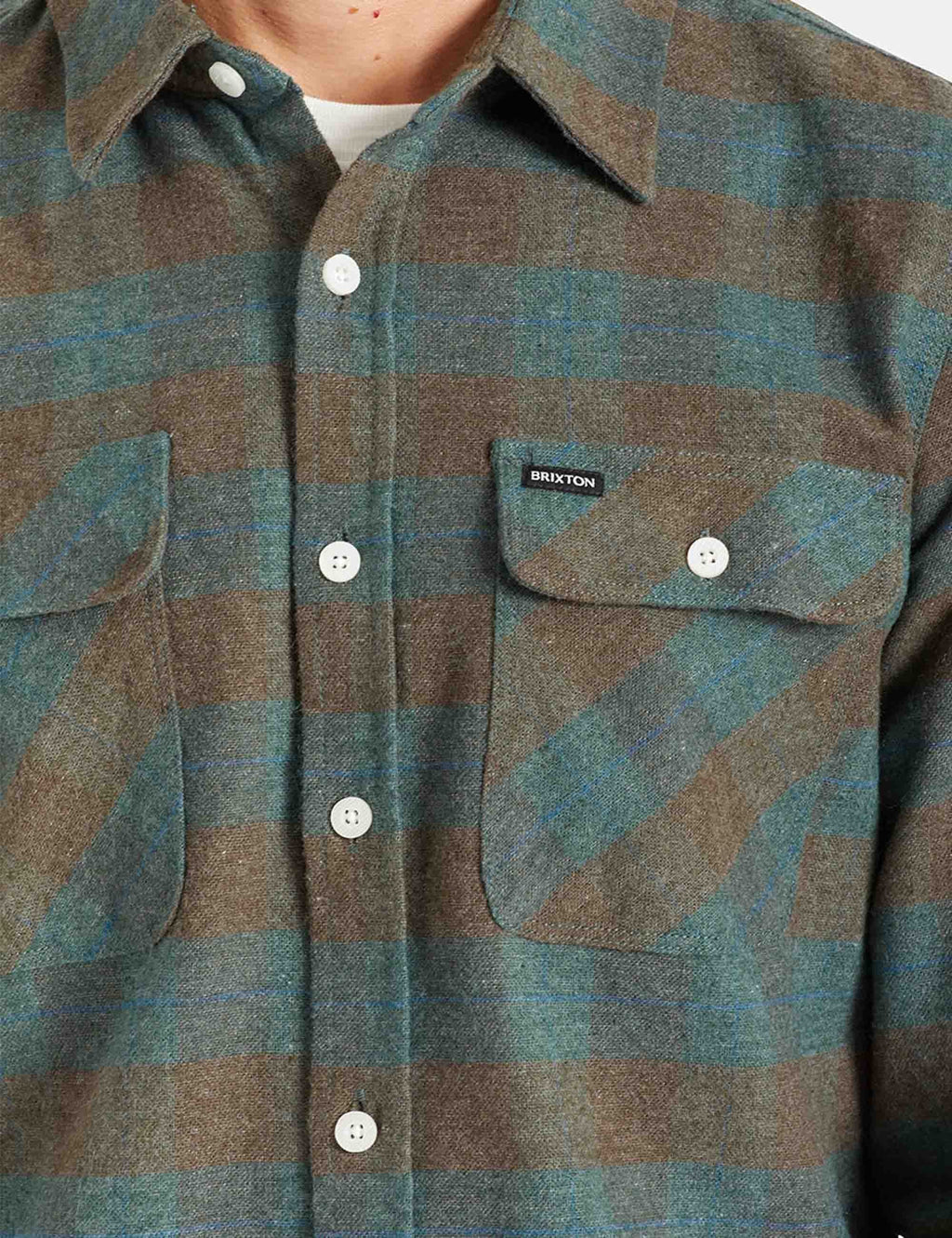 Plaid flannel shirt detail with Brixton label, two chest pockets, white buttons