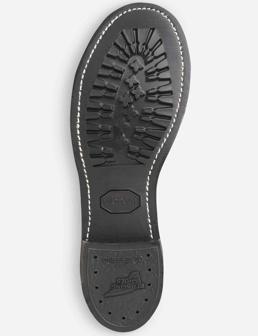 Bottom view of dark brown boot outsole with traction tread and branding stamp