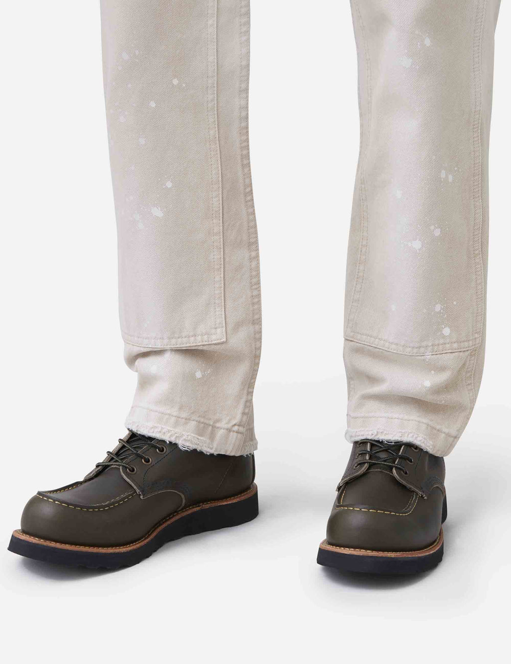 Dark olive leather moc-toe boots with lace-up closure and tan welt