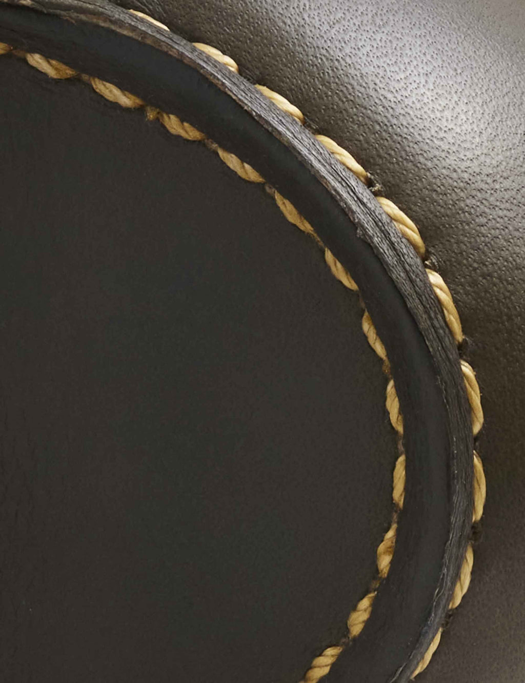 Dark olive leather upper with braided tan welt stitching