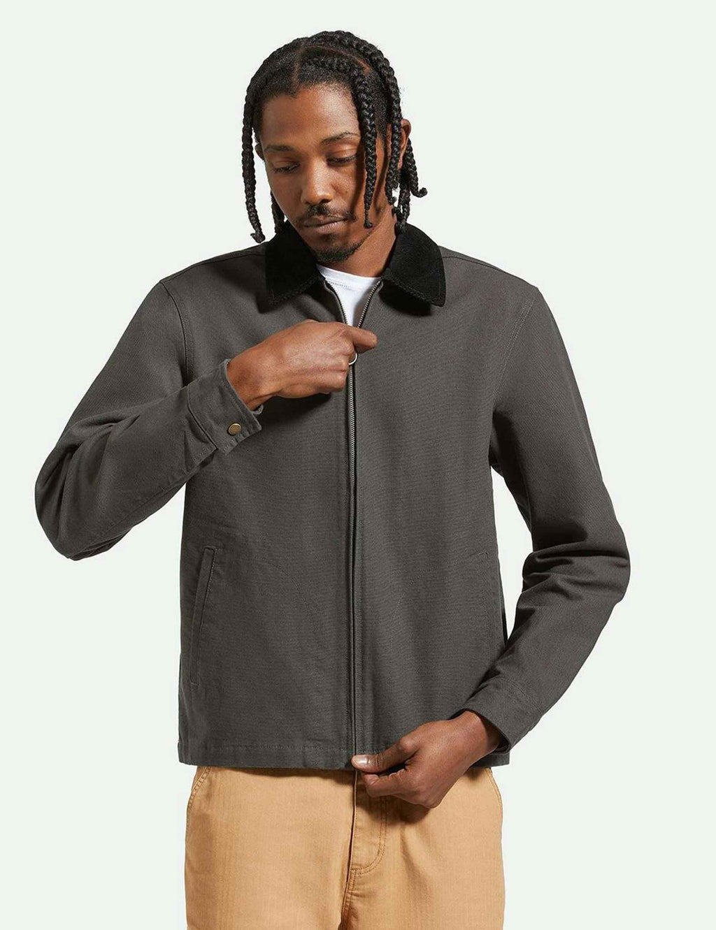 Black mechanic zip jacket with stand collar, front zipper, and small chest logo patch